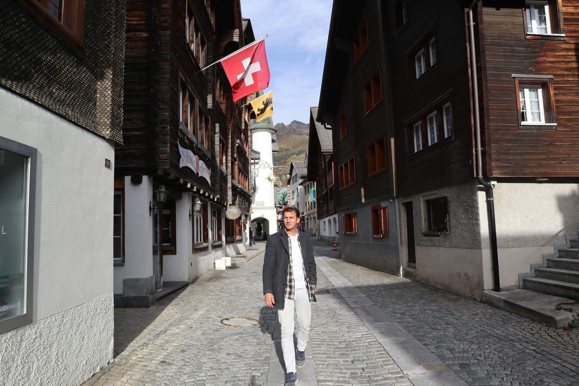 Marco, the private investor behind The Smart Investor, walking through a mountain village street